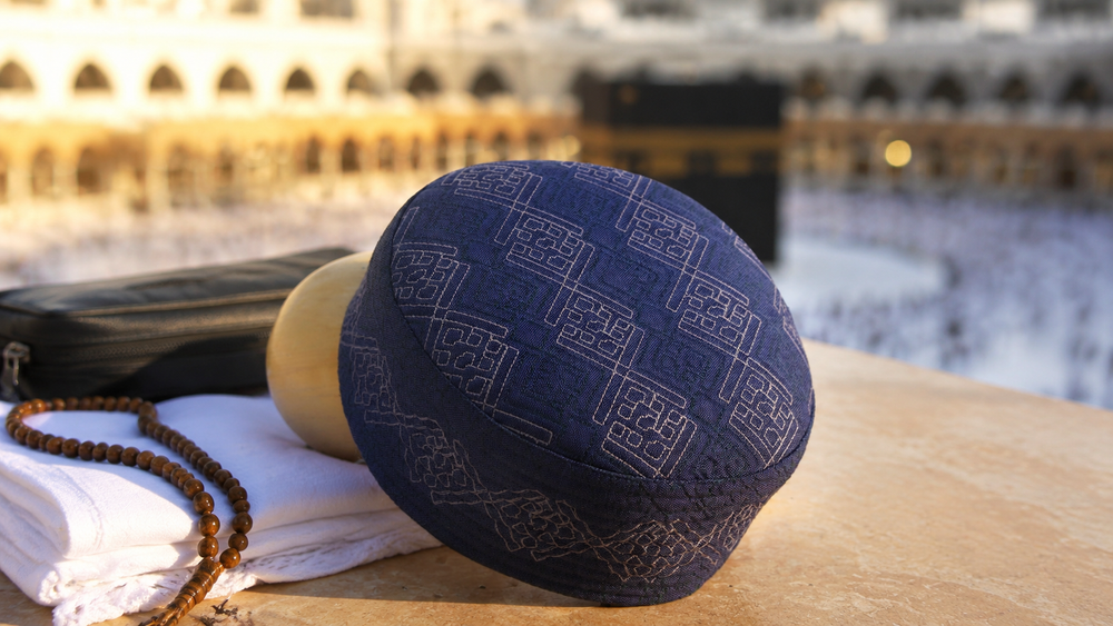 Al-Banuri Arab Koofi in a Hajj and Umrah preparation scene