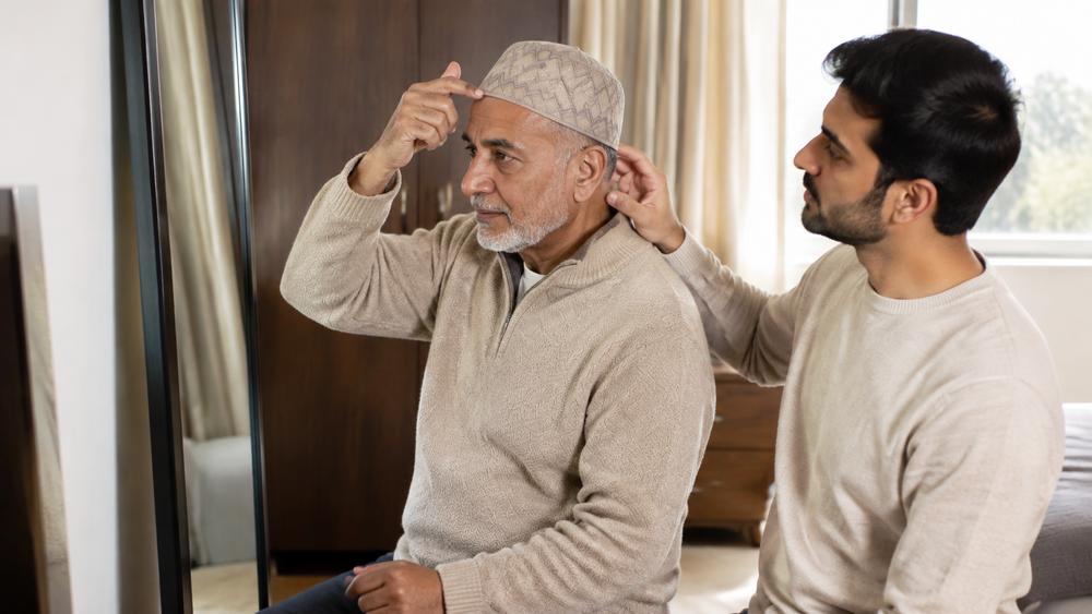 Older father guiding his Tabrez Koofi Beige while his son lightly supports the back edge