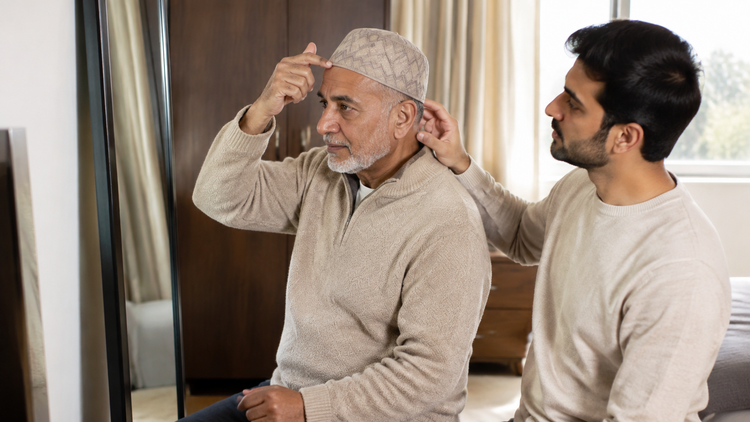 Older father guiding his Tabrez Koofi Beige while his son lightly supports the back edge