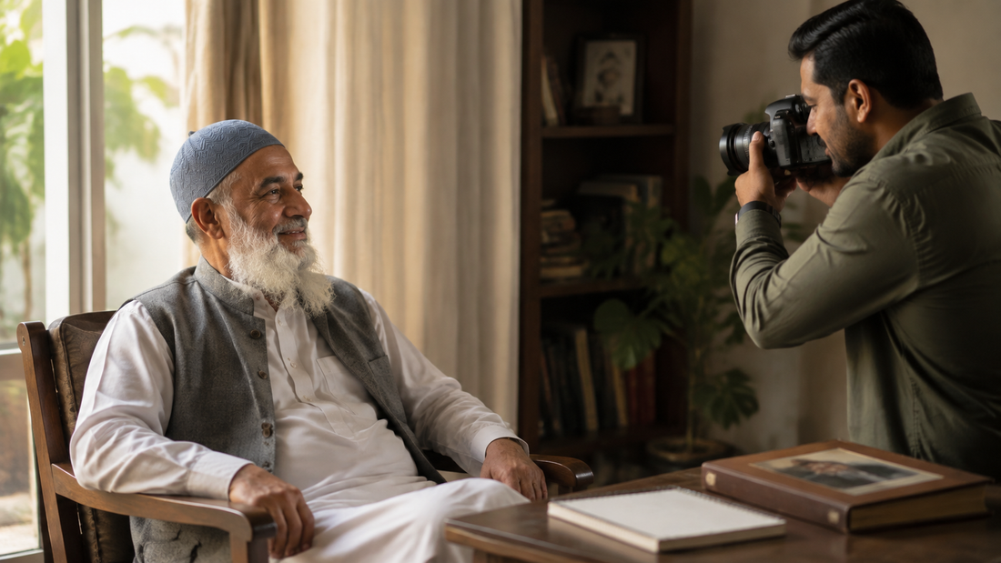 An older father wearing Al-Banuri Tabrez Koofi SeaGreen while his adult son makes a respectful family archive portrait at home